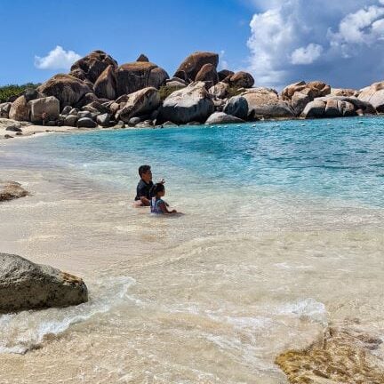 kids sitting inthe baths at virgin gorda